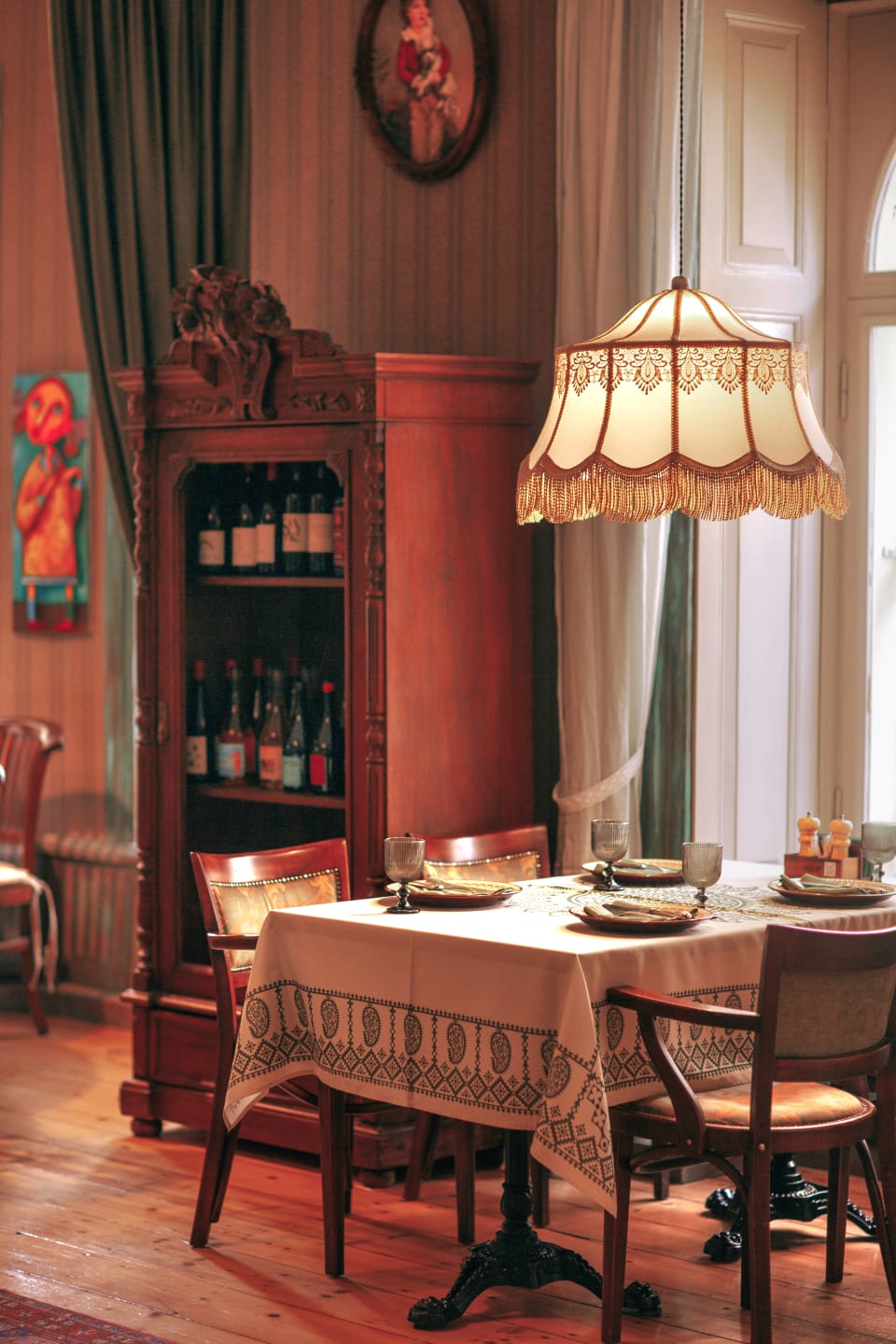 A table beside the tall windows